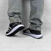 کفش اسپرت مردانه مدل آیداس (Adidas Style) با ترکیب رنگ مشکی و سفید، نمای جانبی.