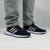 کفش اسپرت مردانه مدل آیداس (Adidas Style) با ترکیب رنگ مشکی و سفید، نمای جانبی.