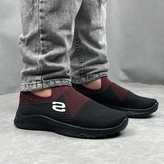 کفش اسپرت مردانه اسکیچرز (Skechers) مدل ورزشی، به رنگ مشکی با جزئیات زرشکی